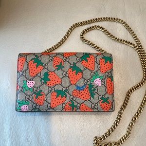 Authentic Gucci crossed body wallet on a chain.